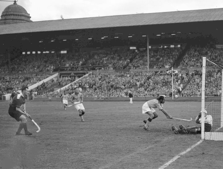 Balbir Singh, second right, tries to score a goal during the men's Olympic Games Hockey match against Great Britain, at Wembley Stadium, London, Aug. 12, 1948. Britain's goalkeeper D.L.S. Brodie saved the attempt and India won the match 4-0.