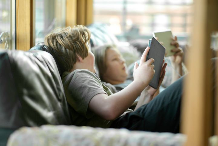 Kids are on screens more during the pandemic, but setting strict time limits might not be the best response.