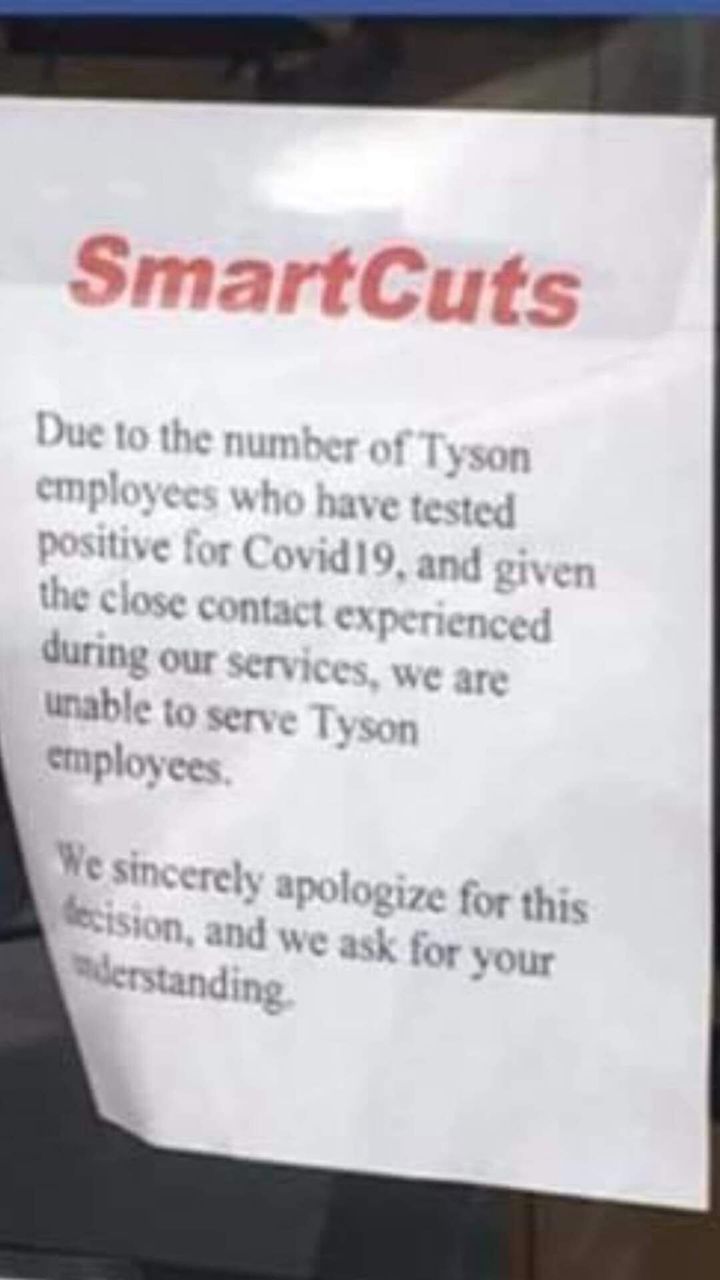 A photo of the sign in the window of SmartCuts in Wilkesboro, North Carolina.