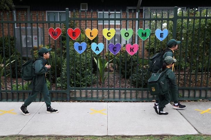 Children return to campus for the first day of New South Wales public schools fully re-opening for all students and staff amidst the easing of the coronavirus disease (COVID-19) restrictions at Homebush West Public School in Sydney. REUTERS/Loren Elliott
