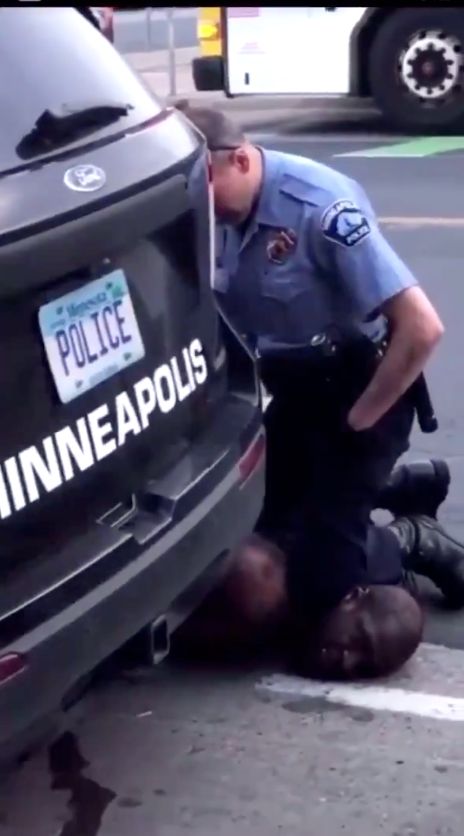 Video captured by a bystander shows a Minneapolis police officer pressing his knee into Floyd's neck.