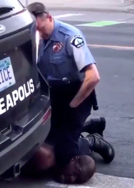 Video captured by a bystander appears to show a Minneapolis police officer pressing his knee into the neck of a handcuffed Black man.