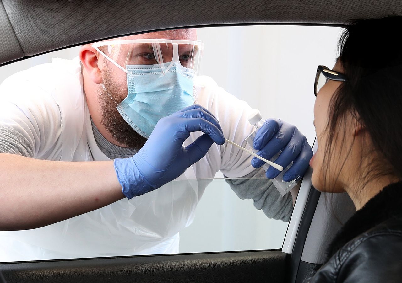 A patient is tested at a drive through testing facility for COVID-19 at Edinburgh Airport after the introduction of measures to bring the country out of lockdown