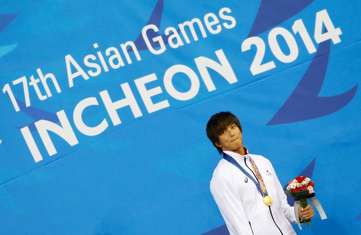 2014年アジア競技大会の50メートル背泳ぎで金メダルに輝く古賀選手