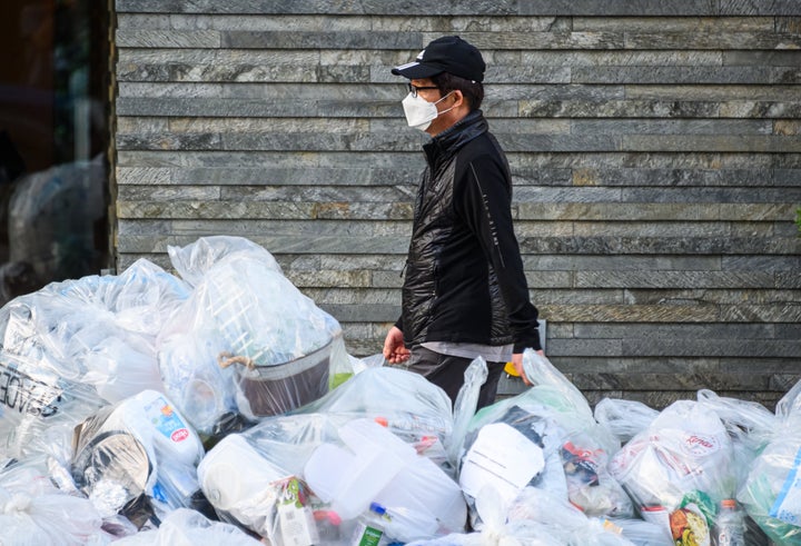 A person wears a protective face mask in New York during the coronavirus pandemic on May 21. The pandemic has allowed plastic
