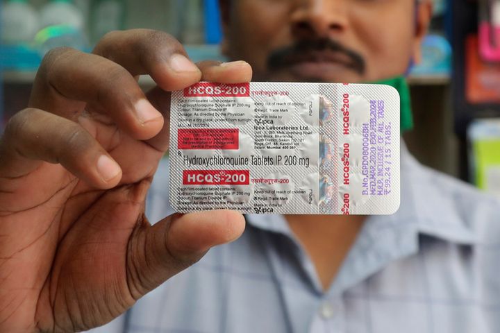 A chemist holds a pack of hydroxychloroquine tablets in Mumbai, India. A recent report in the journal Lancet shows that the malaria drugs pushed by U.S. President Donald Trump as treatments for the coronavirus not only did not help but were tied to a greater risk of death and heart rhythm problems.
