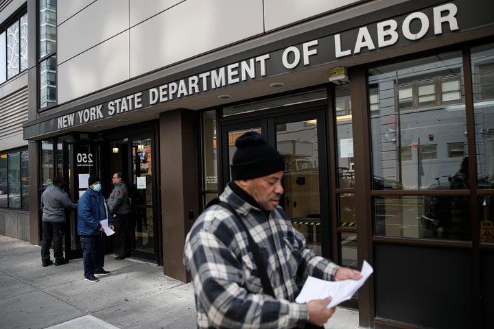 Visitors to the Department of Labor March 18 are turned away at the door by personnel due to closures over coronavirus concerns in New York. A record-high number of people applied for unemployment benefits as layoffs engulfed the United States.