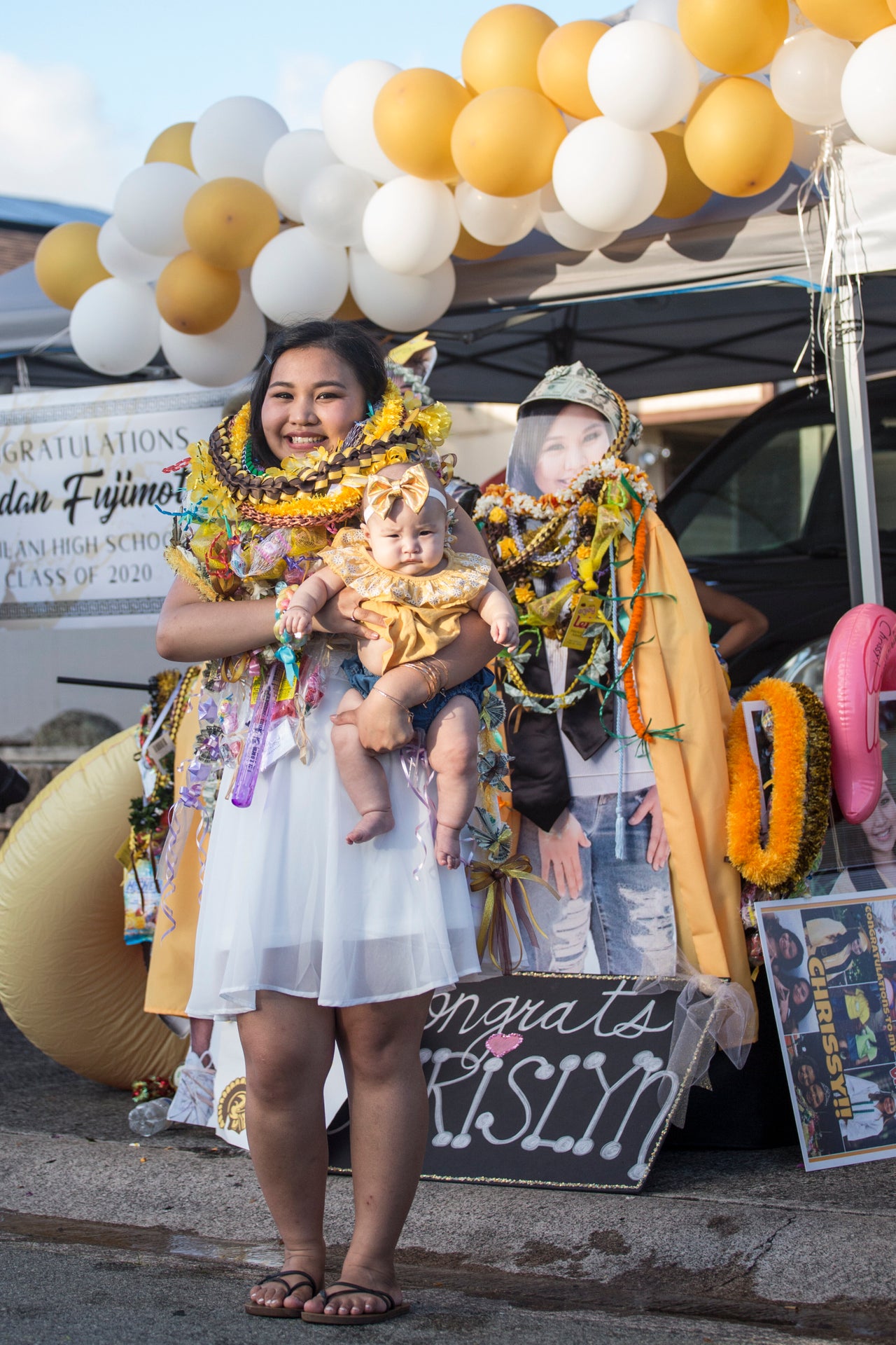 Chrislyn Antonio, a Mililani High School graduate, with her daughter, Embrie-Rose Lanias, in Mililani, Hawaii. Antonio has been busy with a small face-mask business that's named after her daughter.