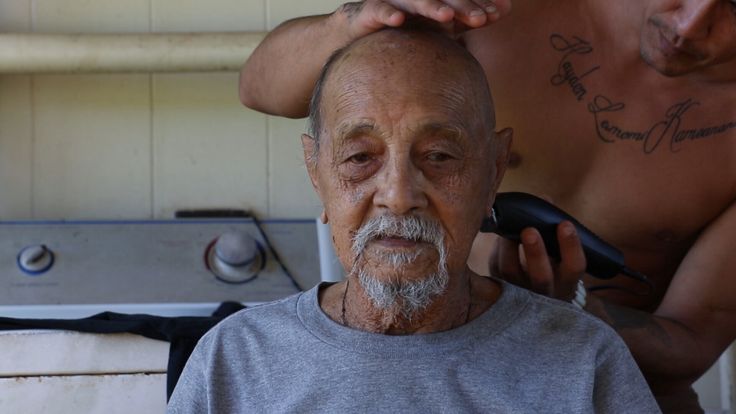 The director’s Great-Uncle Henry getting his hair cut in a scene from the documentary.