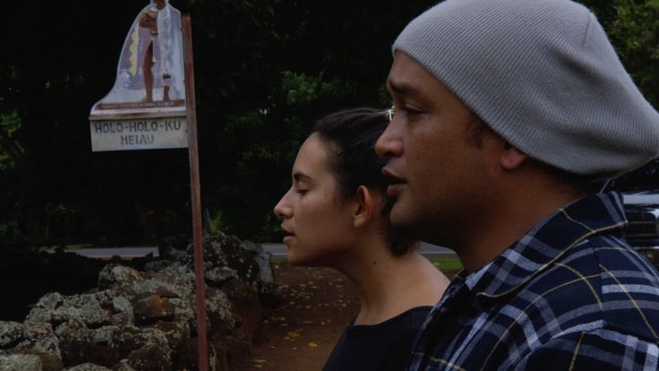 In a scene from the documentary "Cane Fire," Ke’ala Lopez and Kamu “Charles” Hepa lead a Hawaiian chant before a sacred burial site in the Wailua Valley.