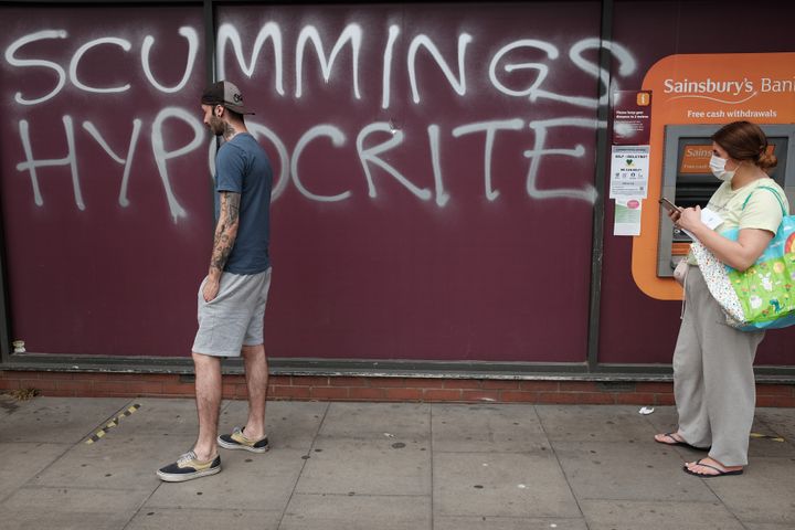 Graffiti protesting against Dominic Cummings is sprayed on a supermarket wall near his north London home, the day after he a gave press conference over allegations he breached coronavirus lockdown restrictions.