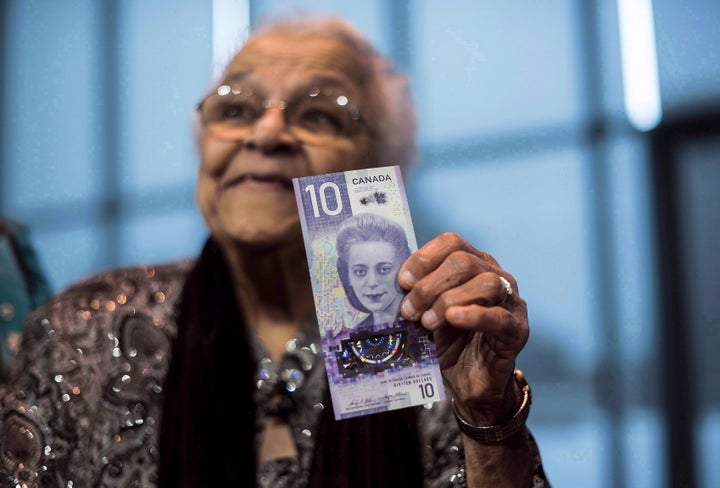 Viola Desmond's sister, Wanda Robson, holds the new $10 bank note featuring Desmond during a press conference in Halifax in March 2018.