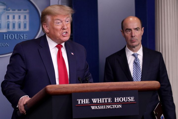 Labor Secretary Eugene Scalia, right, joins President Donald Trump during a daily coronavirus briefing last month at the White House. Senate Democrats have asked the Labor Department to help eligible people switch from regular jobless benefits to special pandemic unemployment aid.