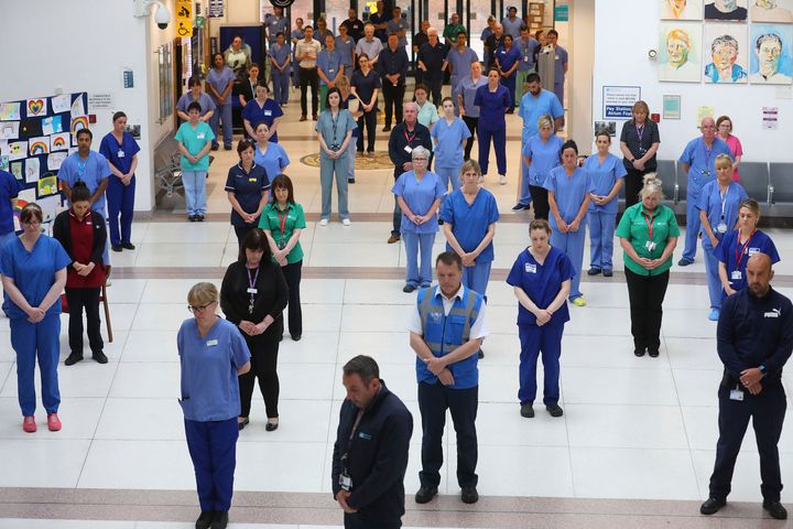 NHS staff at the Mater hospital in Belfast observe a minute's silence to pay tribute to the NHS staff and key workers who have died during the coronavirus outbreak
