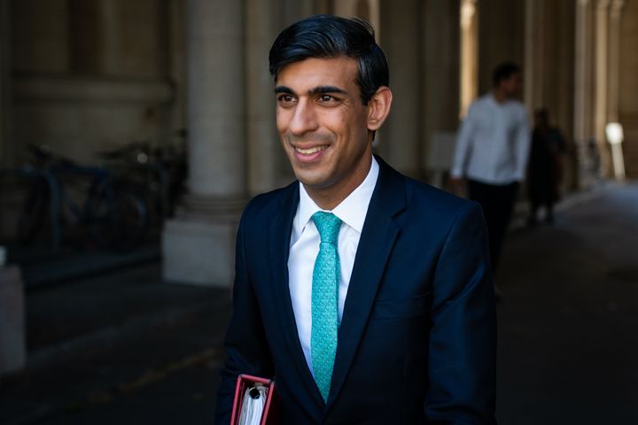 Chancellor Rishi Sunak walks through from the foreign office to Downing Street after the introduction of measures to bring the country out of lockdown
