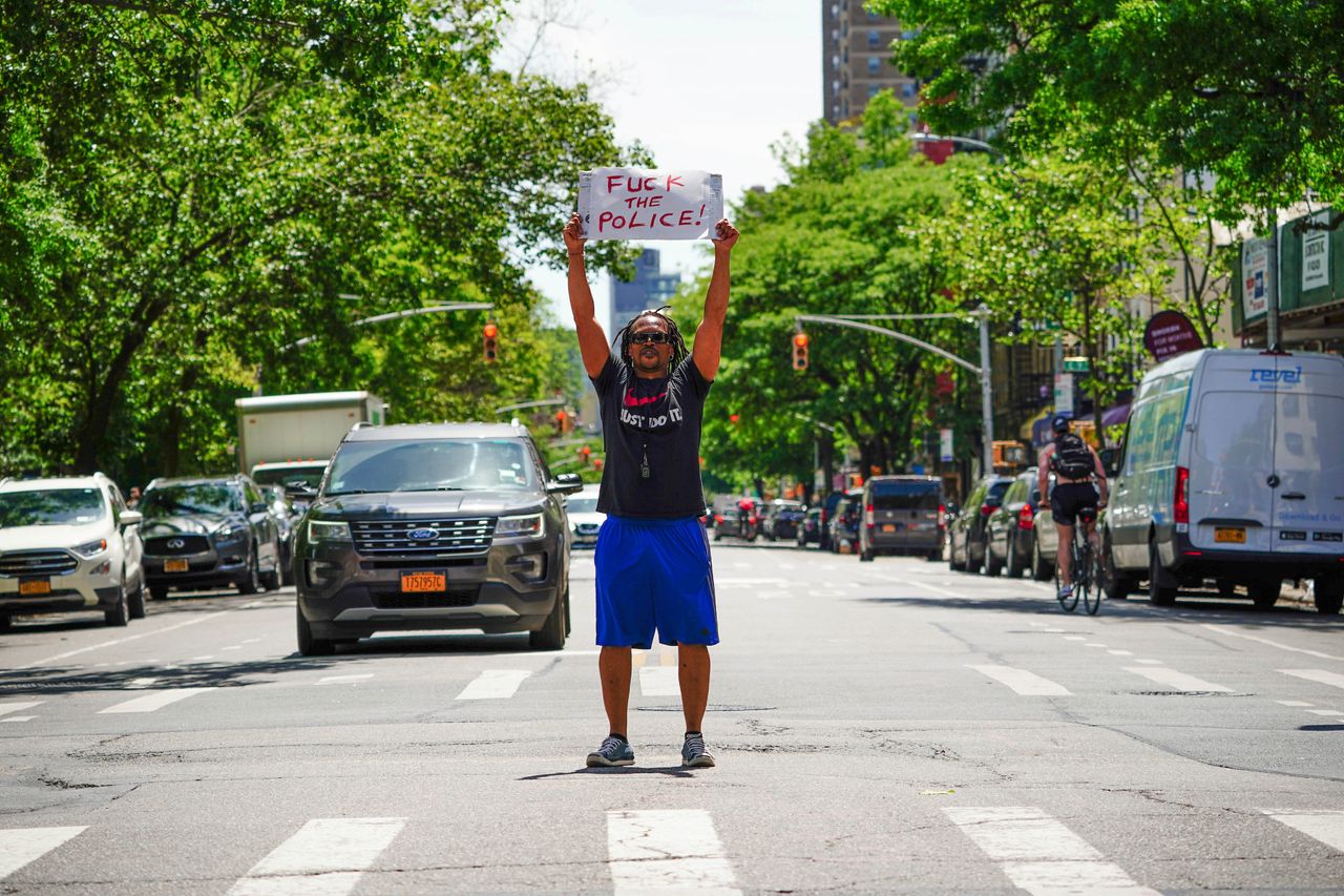A view of East Village artist, Ian Dave Knife staging a protest in New York City.
