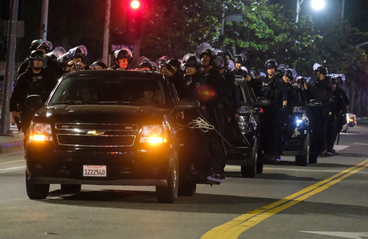 LAPD riot police stand by outside City Hall on Wednesday night.