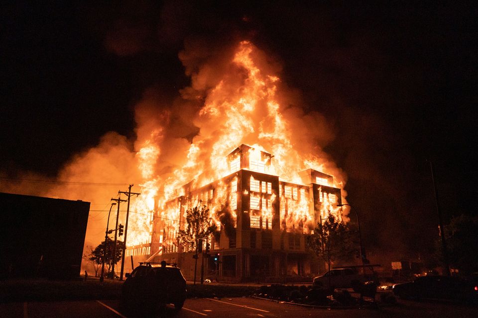 A multi-story affordable housing complex under construction near the Third Precinct, burns on Wednesday night in Minneapolis.