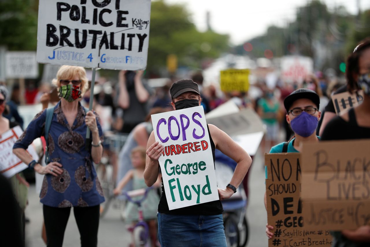 Protesters gather at the scene where George Floyd was pinned down by a police officer kneeling on his neck in Minneapolis, Minnesota May 26.