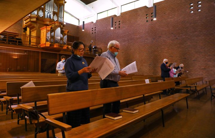 Maria and Siggi Birkis attend a service in the First Lutheran Church in Boston on May 24. They had to make reservations to attend.