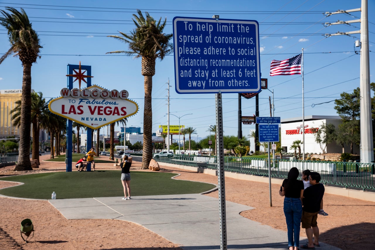 Signs now posted in many parts of Las Vegas stress the recommended social distancing to help stem the coronavirus pandemic.