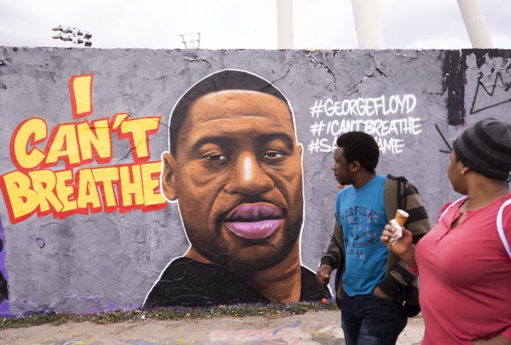 Citizens visit Mauer Park in Berlin on May 29, 2020 to check out a mural of George Floyd, who died in police custody in Minneapolis, Minn. on Monday night.