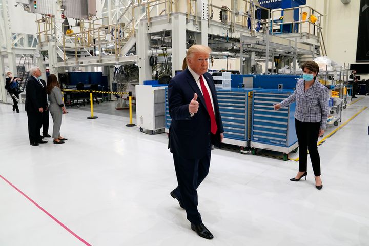 President Donald Trump tours NASA facilities with Lockheed Martin CEO Marillyn Hewson before the scheduled SpaceX launch Wednesday at Kennedy Space Center in Cape Canaveral, Fla. The Wednesday launch was scrubbed.