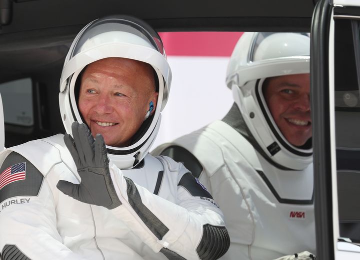 NASA astronauts Bob Behnken (right) and Doug Hurley, best friends, in a vehicle prior to the SpaceX launch on Saturday.