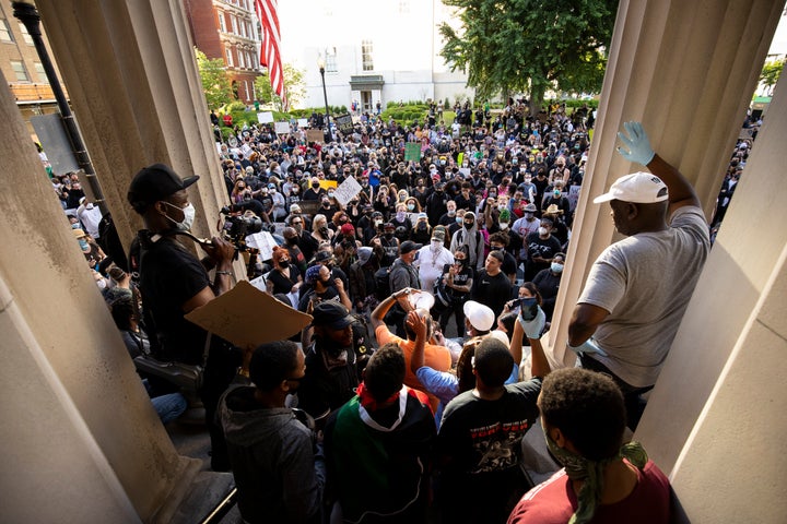 Protesters gathered outside of City Hall after a peaceful march across the city on May 29 in Louisville.