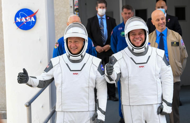 NASA commercial crew astronauts Doug Hurley, left and Bob Behnken, right, leave for their flight aboard the SpaceX Falcon 9 rocket bound for the International Space Station.