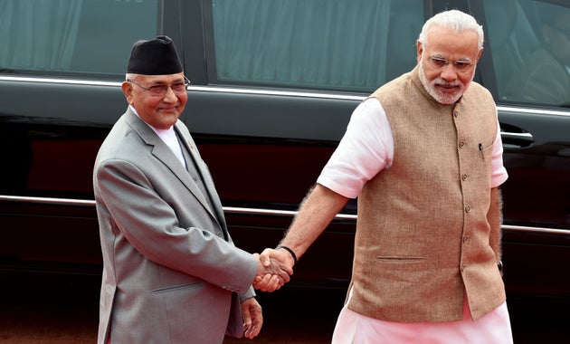 Prime Minister Narendra Modi and Nepal Prime Minister KP Oli during a ceremonial reception in New Delhi...