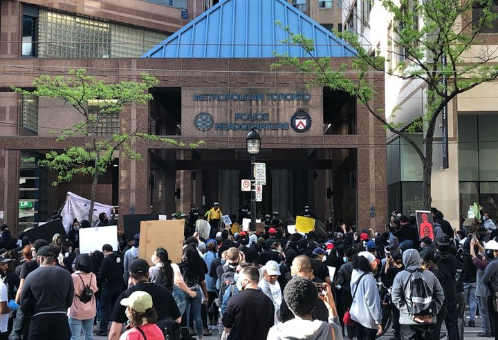 People gathered in front of Toronto police headquarters demanding justice in the death of 29-year-old Regis Korchinski-Paquet.
