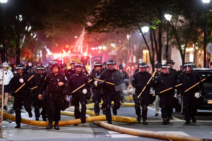 Police push down a street in Philadelphia on May 30, 2020 during a protest over the death of George Floyd.