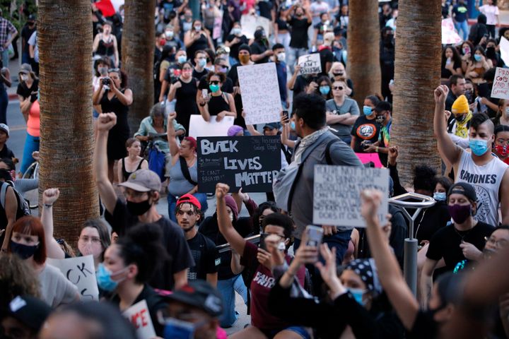 Protesters rally Saturday, May 30, 2020, in Las Vegas, over the death of George Floyd, a Black man who was in police custody in Minneapolis. (AP Photo/John Locher)