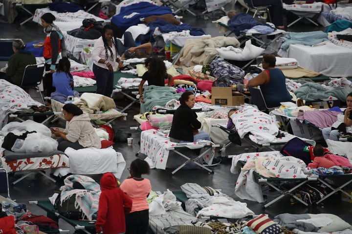 People are seen sheltering at the George R. Brown Convention Center in Houston after floodwaters from Hurricane Harvey inundated the city in 2017.