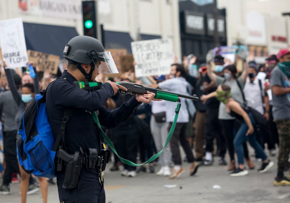 A police officer prepares to fire rubber bullets during a protest over the death of George Floyd, a handcuffed black man in police custody in Minneapolis, in Los Angeles on May 30, 2020.