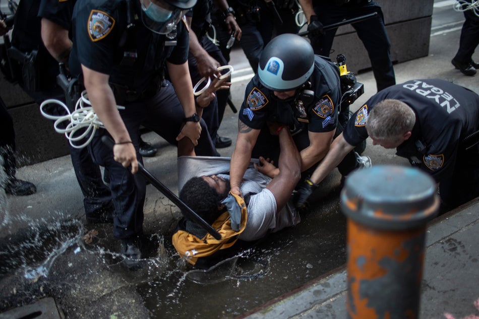 Police arrest a protester during a solidarity rally for George Floyd on May 30, 2020 in New York. Protests were held throughout the city over the death of George Floyd, a Black man who was in police custody in Minneapolis. 