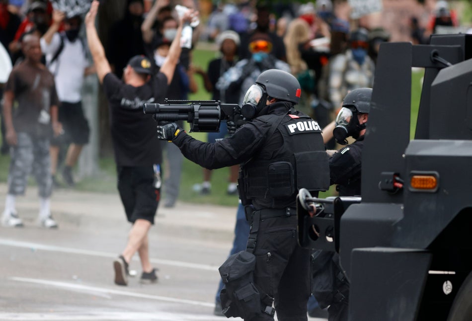 Denver police fire pepper balls during a protest outside the State Capitol on May 30, 2020.