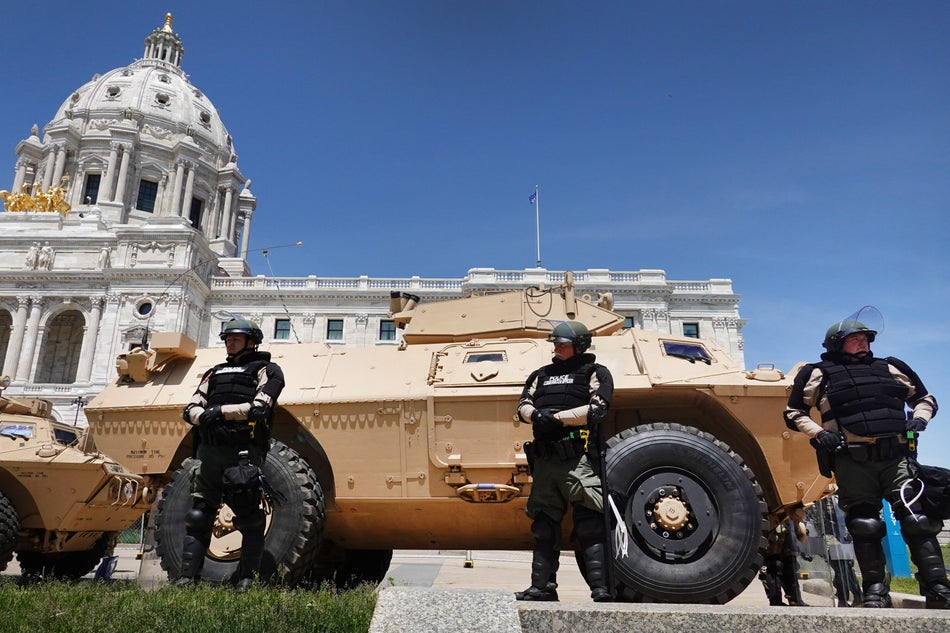 Police in St. Paul, Minn. stand guard at the state capital building on on May 31, 2020 during a protest as unrest continues in the city and around the U.S. following the May 25 death of George Floyd.