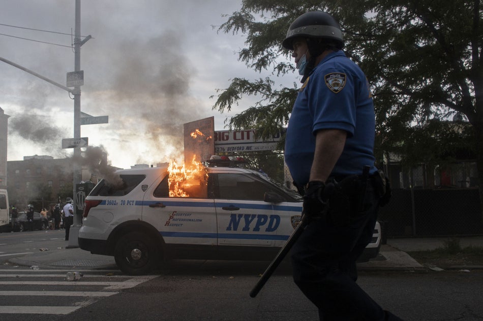 Protesters in New York City set a police vehicle on fire on May 30, 2020 during a protest following the death of George Floyd in Minneapolis.