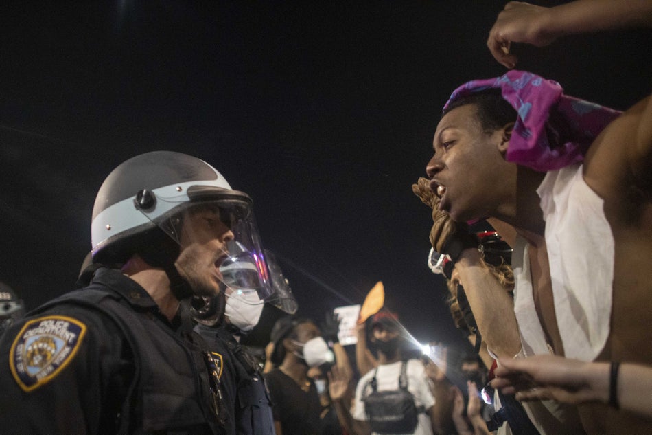 Protesters clash with police officers during a protest on May 30, 2020.