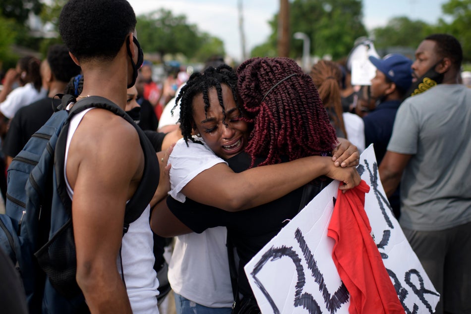 George Floyd's niece Gabrielle Thompson, centre, cries as she hugs another woman during a "Justice for George Floyd" event in Houston on May 30, 2020.