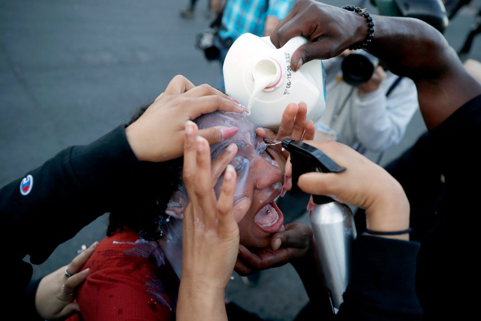A protester has her eyes washed after being exposed to tear gas on May 30, 2020 in Minneapolis.