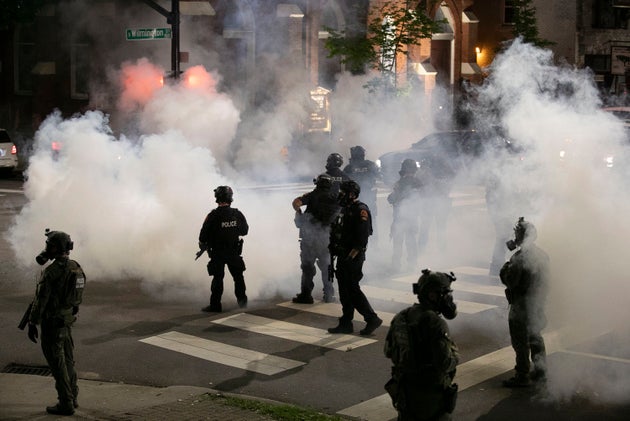 Police in Raleigh, North Carolina, fire tear gas to disperse a crowd of demonstrators in front of the First Baptist Church early Sunday morning.