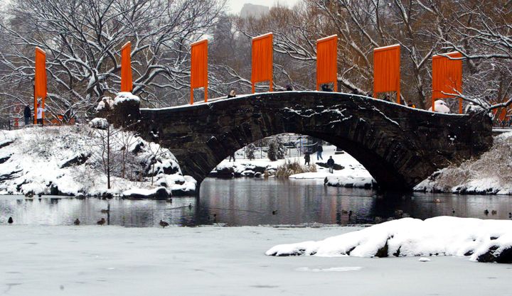 "The Gates" art installation created by Christo and Jeanne-Claude lines a snow-covered bridge in New York's Central Park in 2005. 