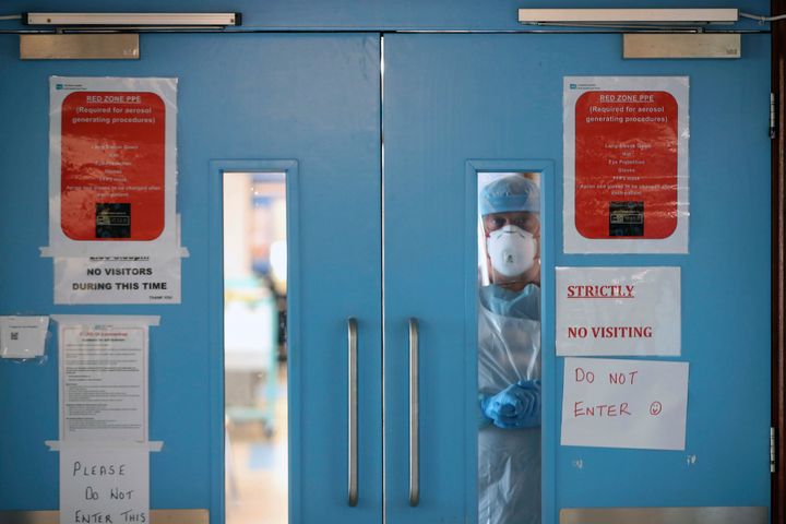 Infection control nurse Colin Clarke looks out from a Covid-19 recovery ward at Craigavon Area Hospital in Co Armagh, Northern Ireland