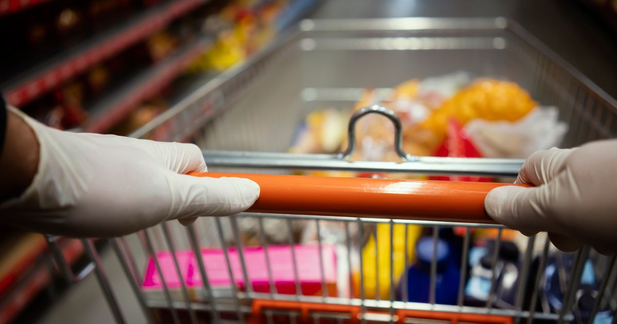 Why Wearing Gloves To The Grocery Store Won't Protect You From COVID-19