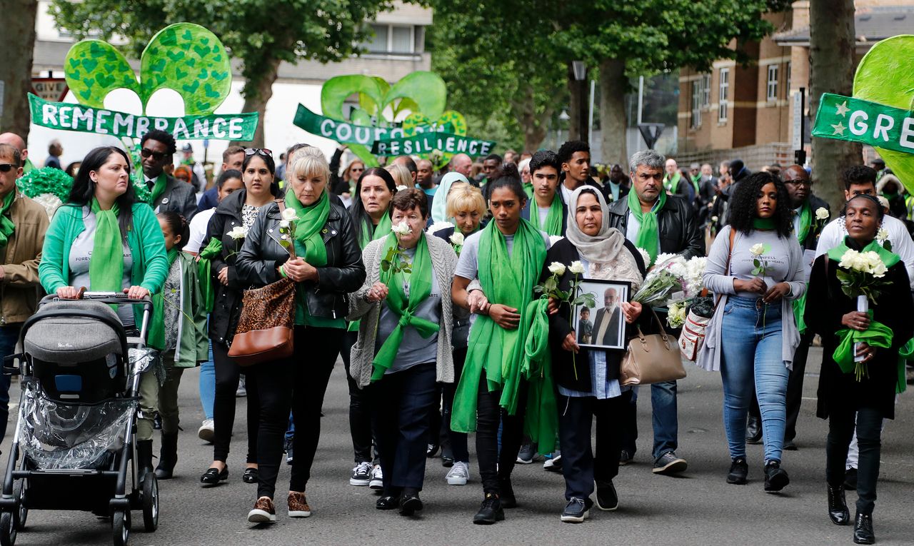 People march to mark the two-year anniversary of the Grenfell Tower block fire in 2019. 
