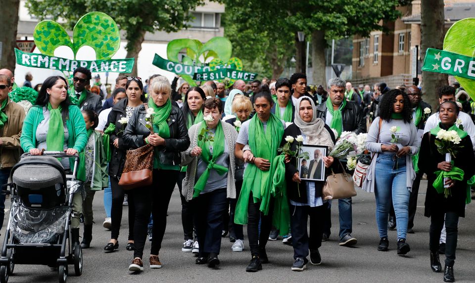 People march to mark the two-year anniversary of the Grenfell Tower block fire in 2019. 