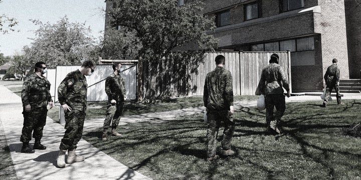 Military personnel change shifts at a Toronto long-term care home on May 26, 2020. They've taken over Ontario homes struggling to cope with the pandemic. 